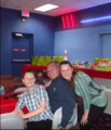 Daniel at his 13th birthday party with Elisabeth, and his step-father, James Avey.